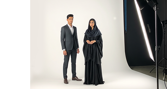 A-photo-featuring-a-male-and-female-model-standing-in-a-professional-studio